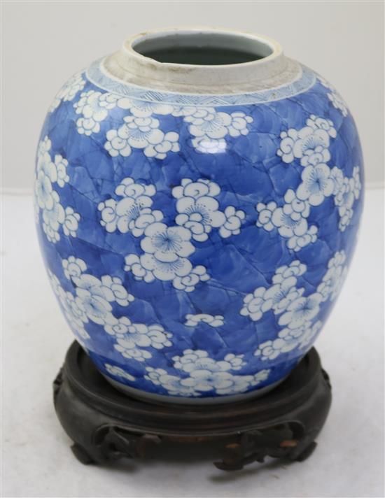 A Chinese blue and white ovoid jar, 18th century, height 21.5cm, wood stand